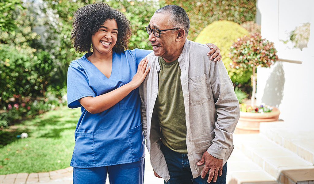 Skilled Nursing patient at Lake Forest Place enjoying a walk outdoors with his caregiver