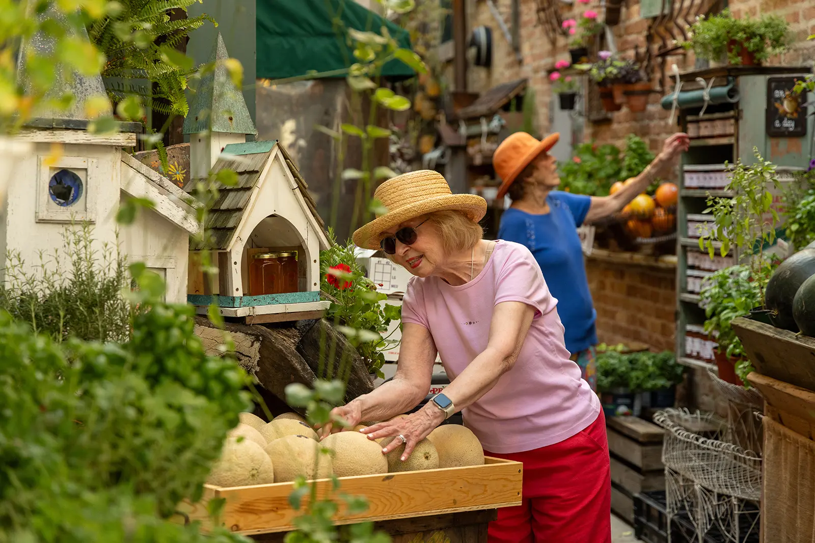 Woman selecting fruit at a Farmers Market near Lake Forest Place