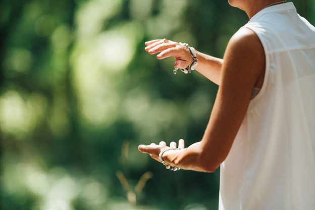 close up of a woman's hands as she practices Tai Chi