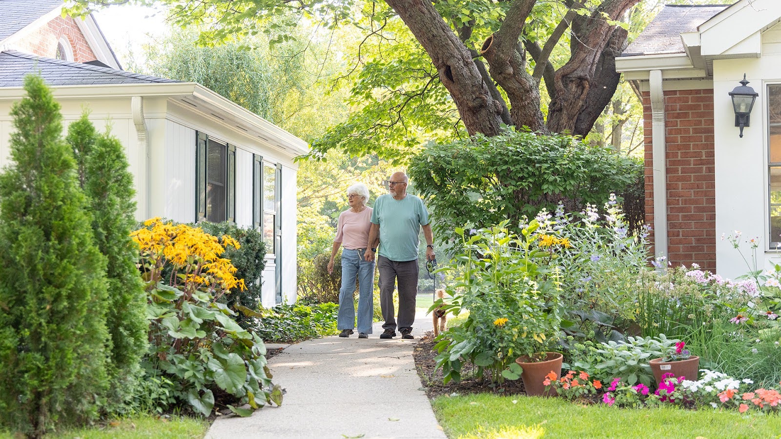 Happy senior couple walking outdoors at Westminster Place