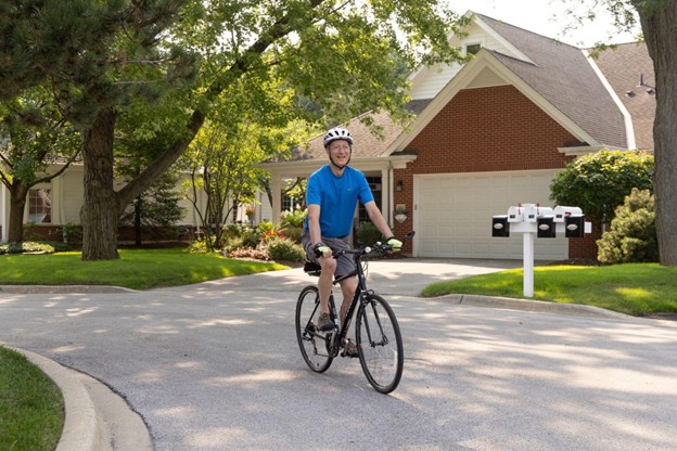 senior man riding a bicycle outside