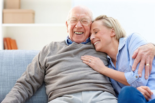 senior man and woman share funny moment together