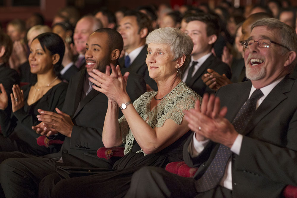 Group of seniors attending a show at the theater