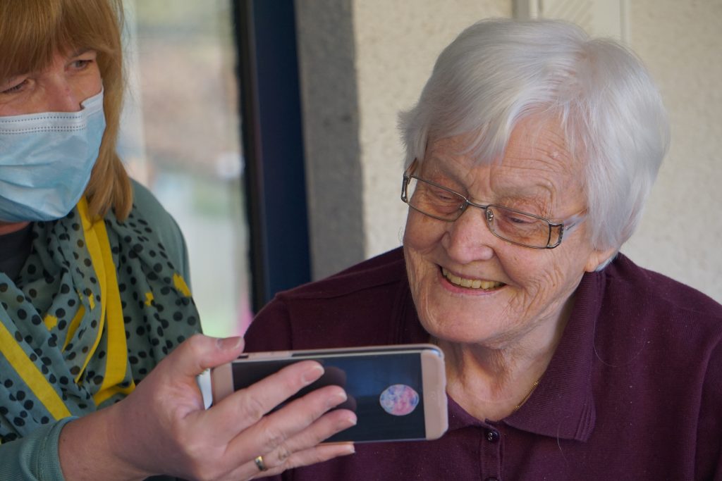 senior woman with caregiver in assisted living